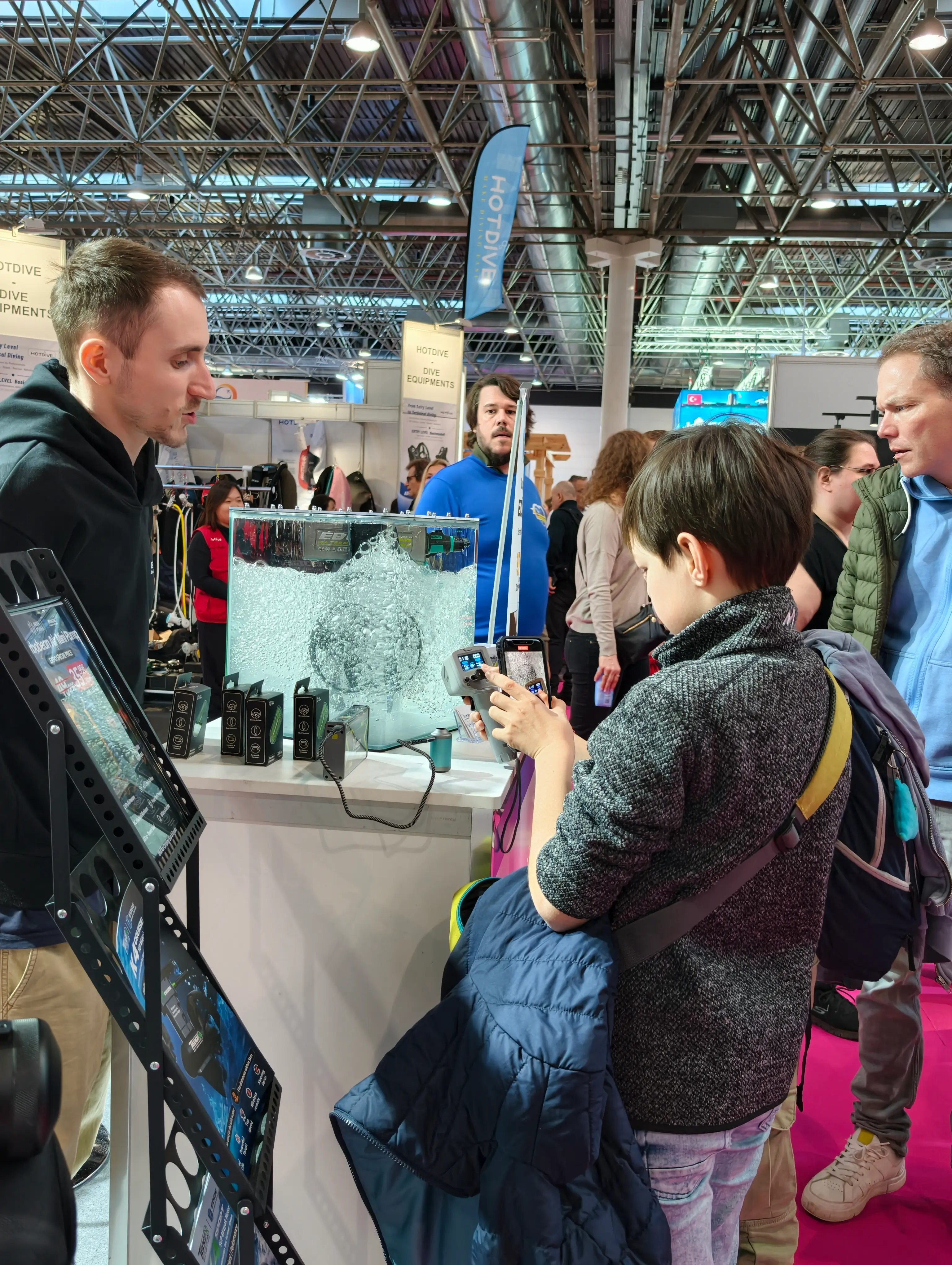 Visitors examining Tedgix K4 slide-in kayak motor installation system at BOOT 2026