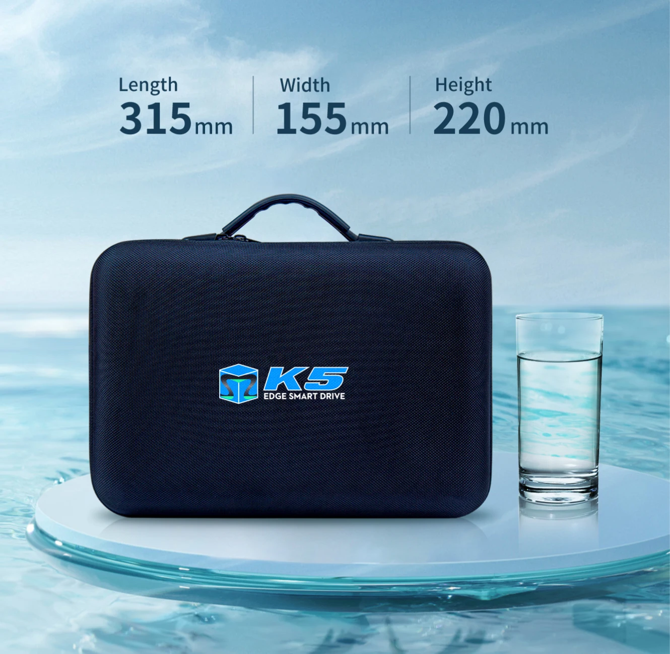 The Tedgix K5 stored in its compact, travel-friendly carrying case next to a glass of water for scale.