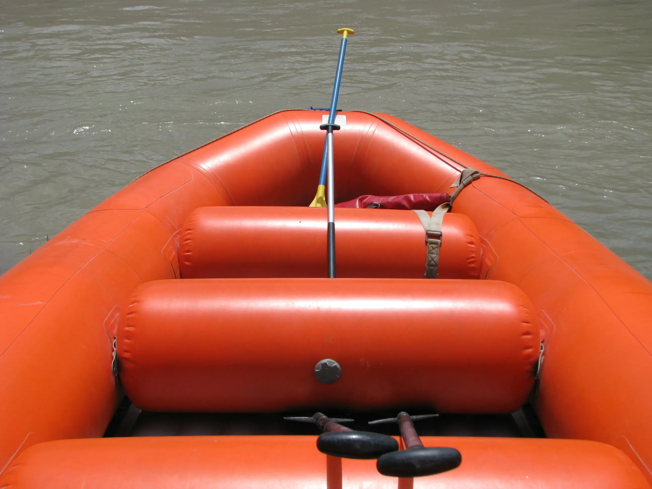 Recreational inflatable boat on calm water, representing multi-purpose use beyond fishing-focused kayaking